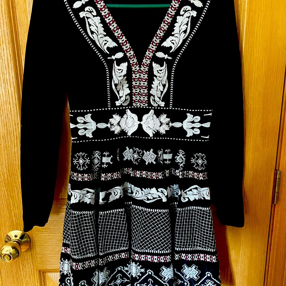 Beautiful suze 2 fit and flare black dress.  Embroidered with white beads.